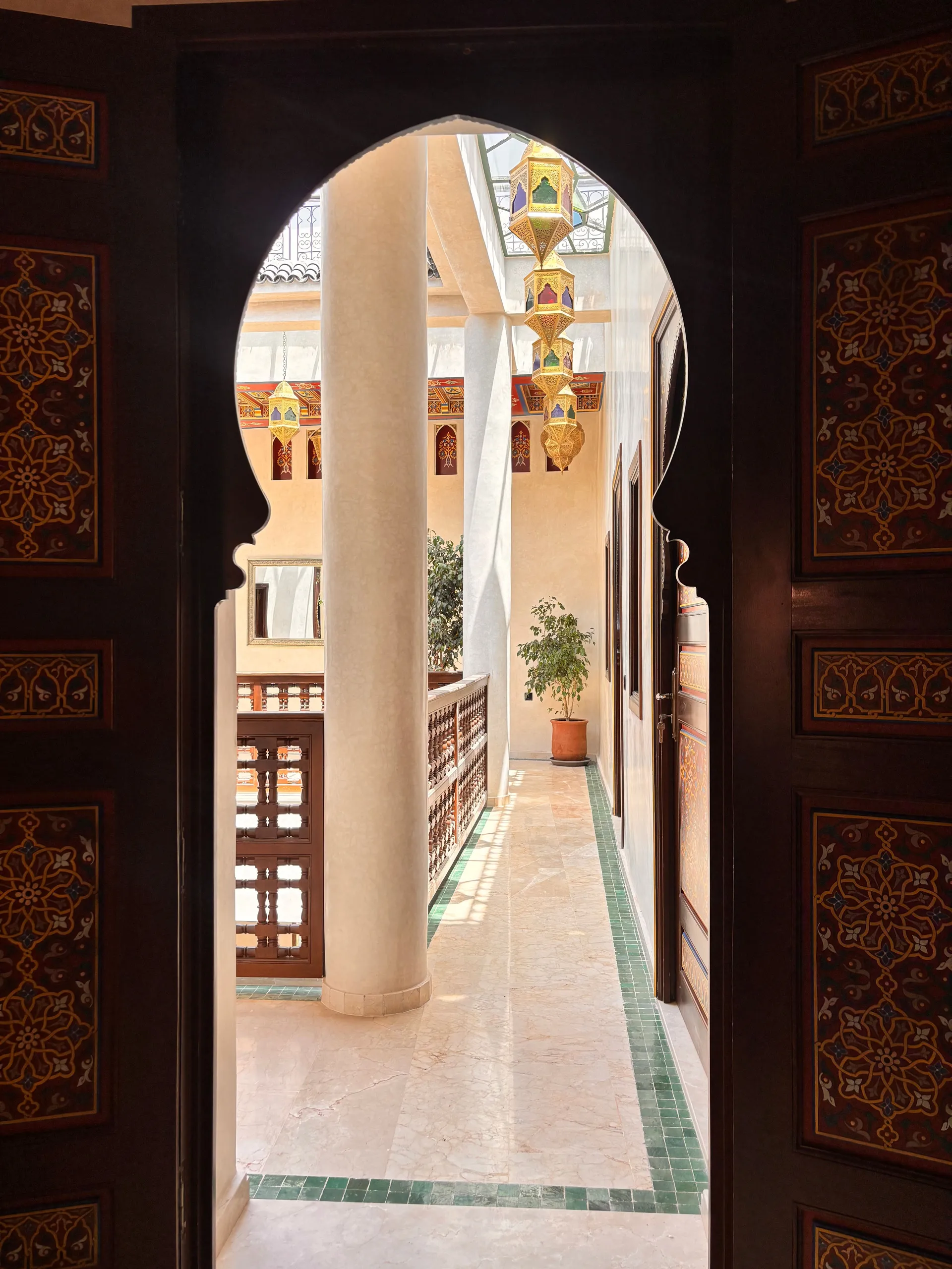 Carved wooden doors with geometric arabesques