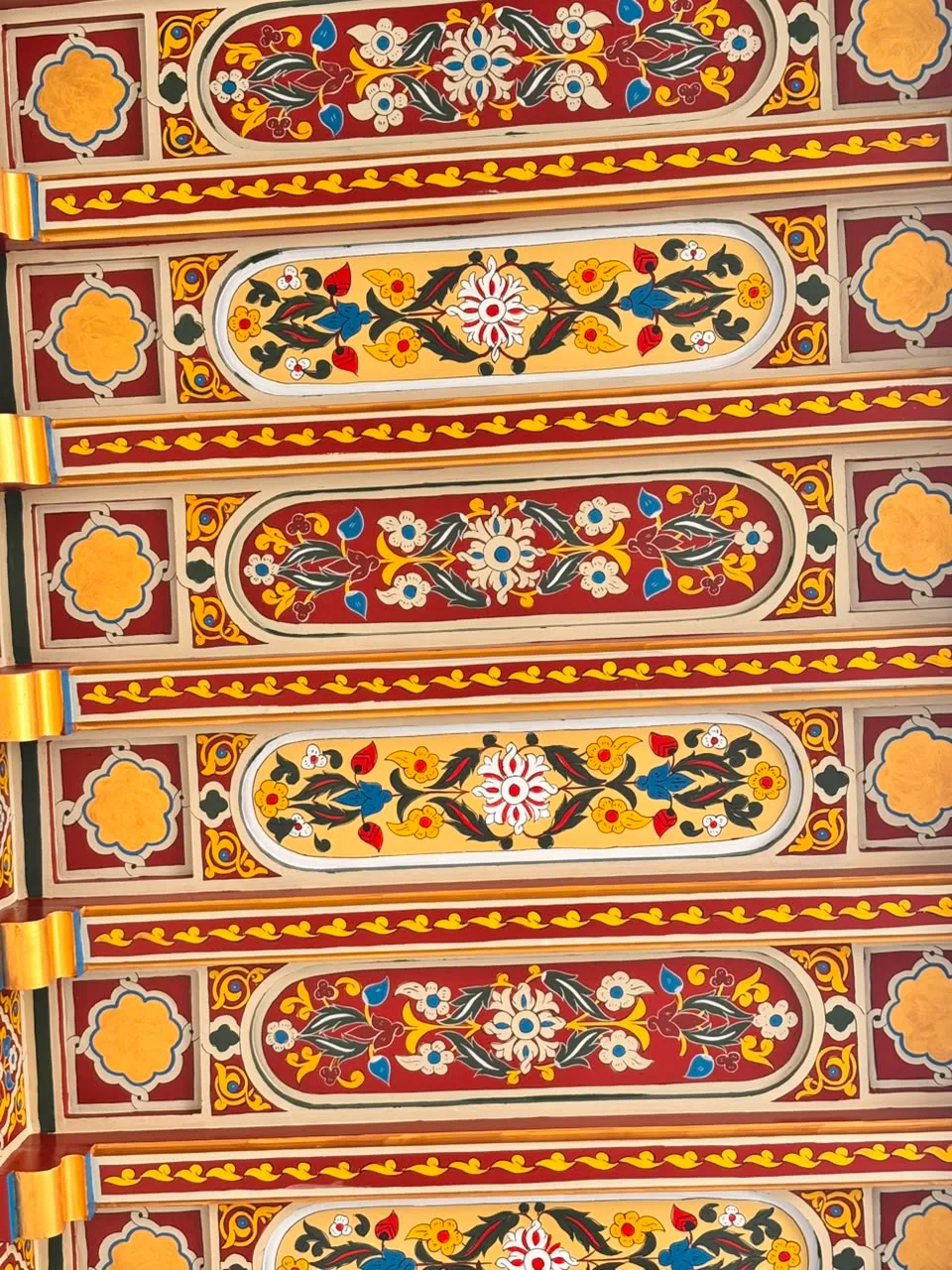 Hand-painted cedar ceilings with original pigments