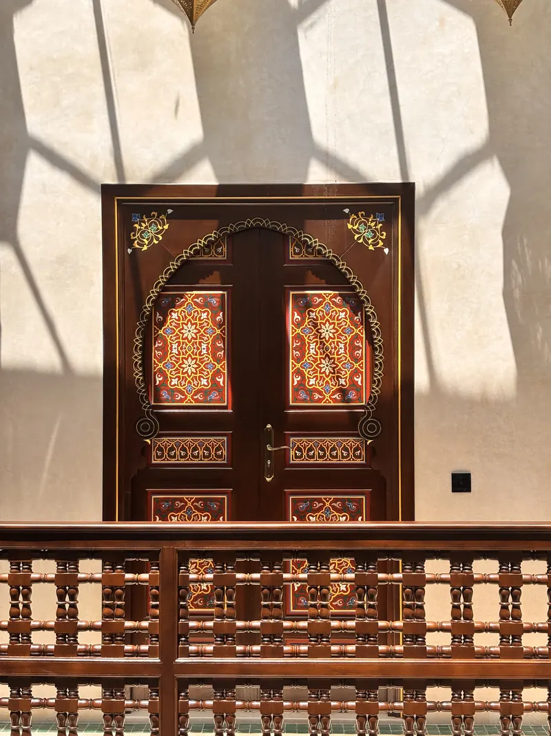 Hand-painted door on the gallery, under the skylight