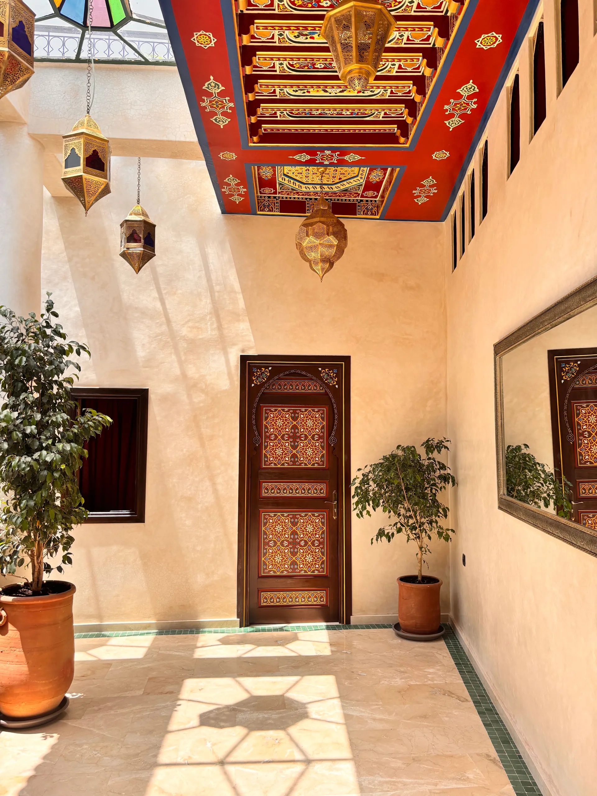 Carved wooden doors with geometric arabesques