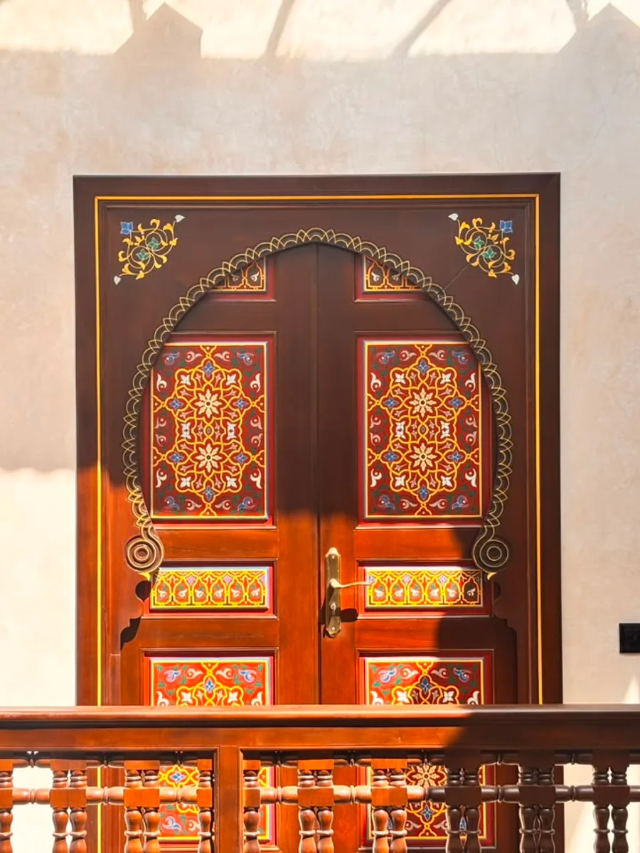 Carved wooden doors with geometric arabesques