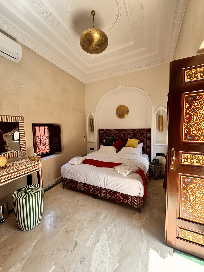 A room: marquetry dressing table, bed and painted door